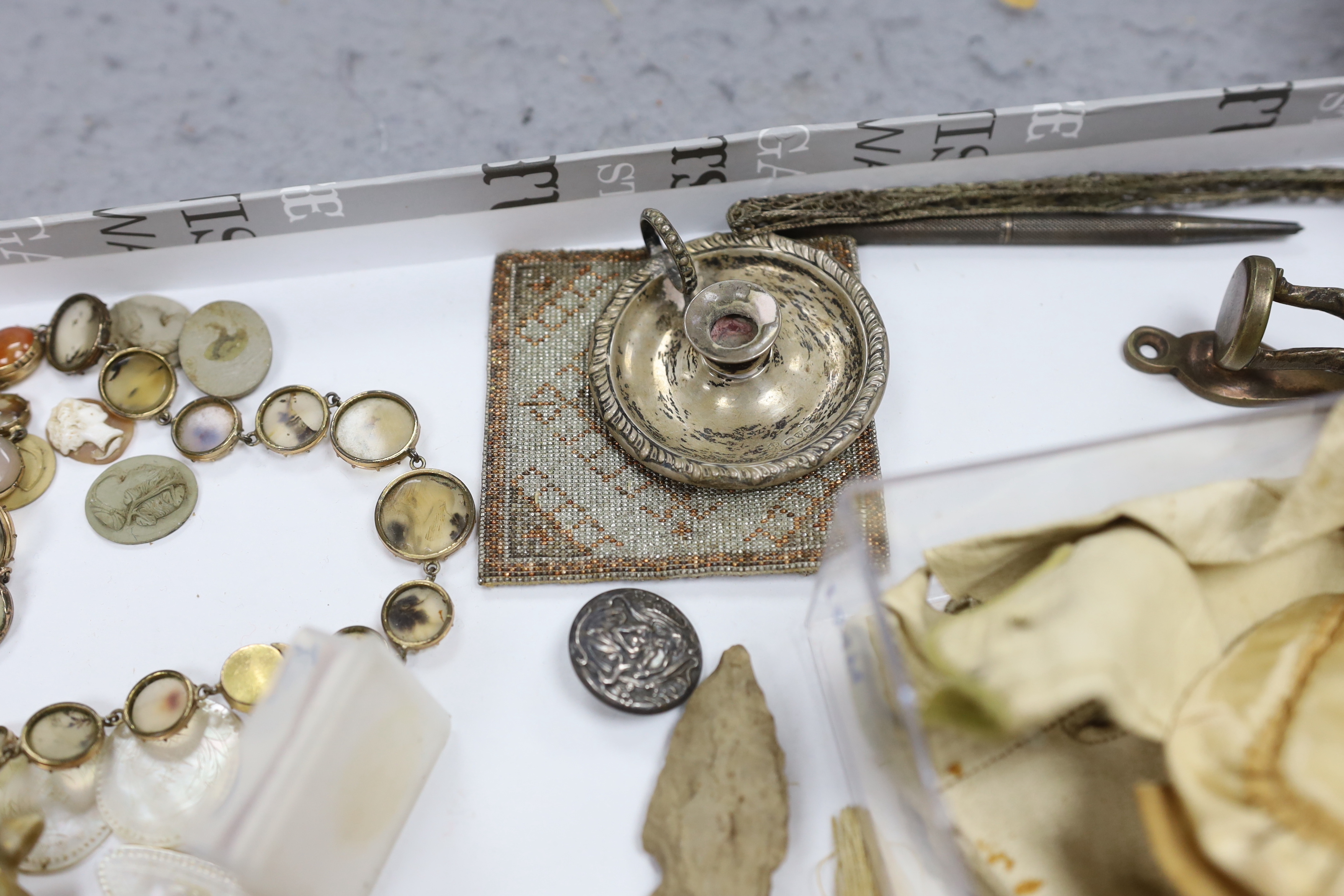 A collection of cabinet curiosities, including carved lava portrait medallions, porcelain scent bottles, etc. (a large quantity)